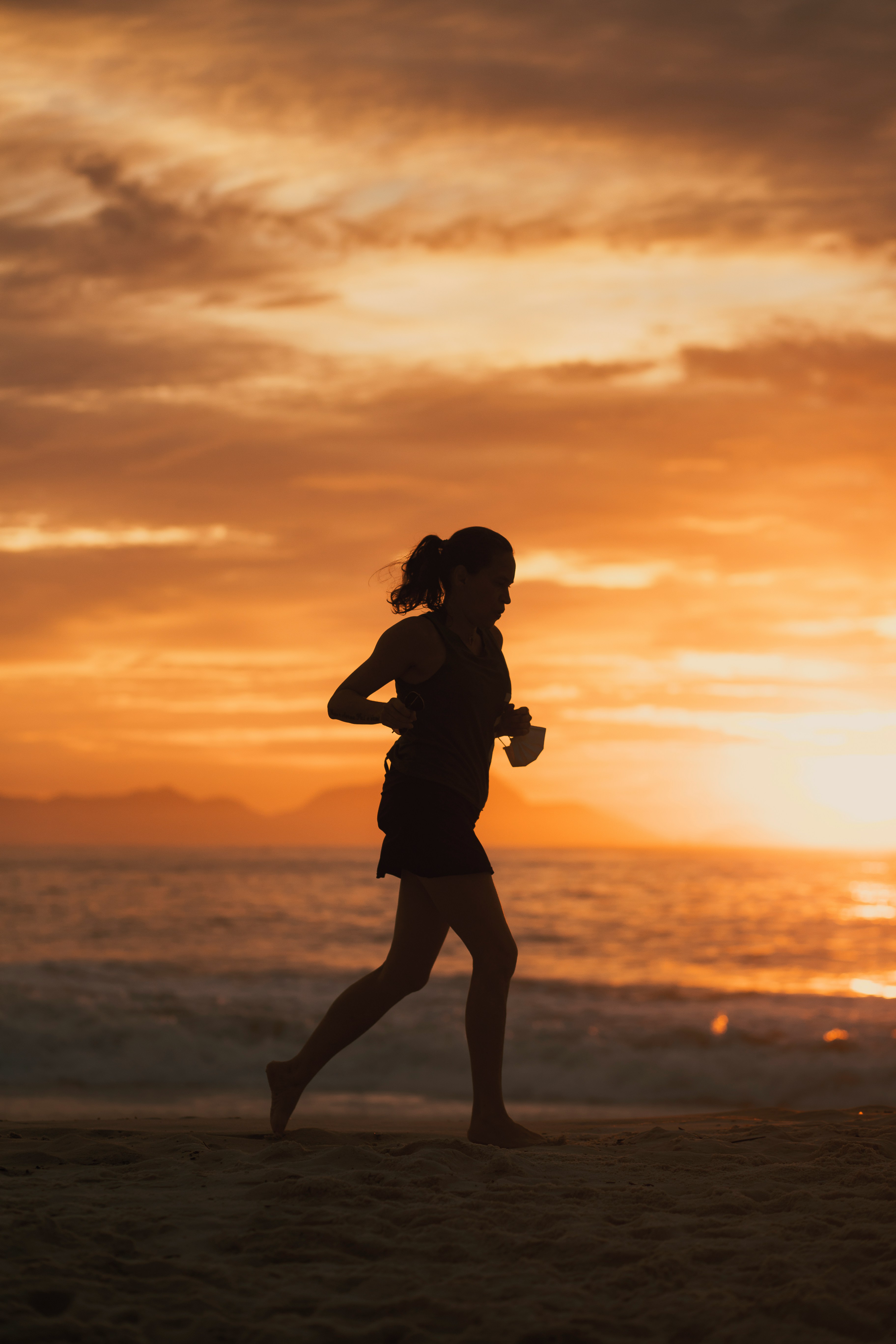 Woman Running at Sunset